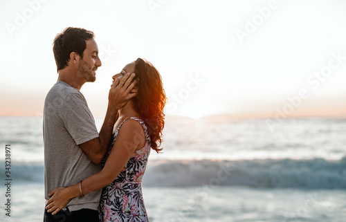 Loving couple sharing a romantic moment together on a beach
