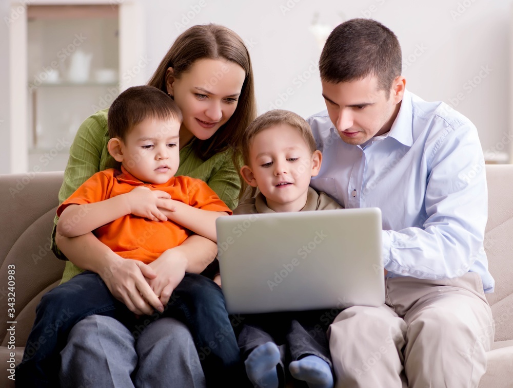 Young family surfing internet and looking at photos Young family surfing internet and looking at photos