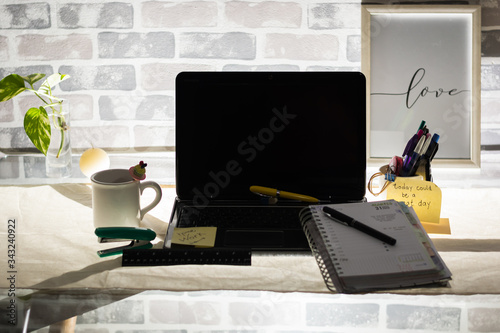 home office work with laptop planner and desk pens