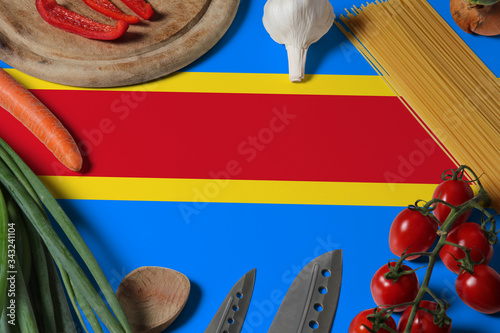 Congo flag on fresh vegetables and knife concept wooden table. Cooking concept with preparing background theme.