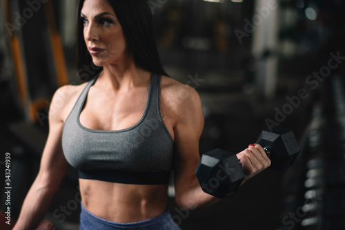 Fitness woman on training. Young woman in the gym. 