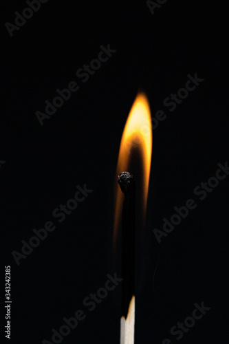 Ignition and burning matchstick flame
