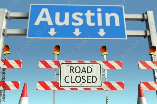 Traffic barricades at Austin city traffic sign. Coronavirus disease quarantine or lockdown in the United States conceptual 3D rendering © Alexey Novikov
