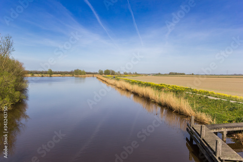 Wooden jetty at the canal outside Winschoten  Netherlands