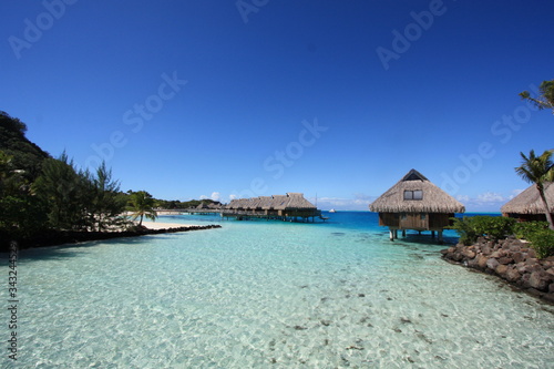 A paradise island with white sand beach  turquoise water  coco palms and over-water bungalows for a relax travel holidays.