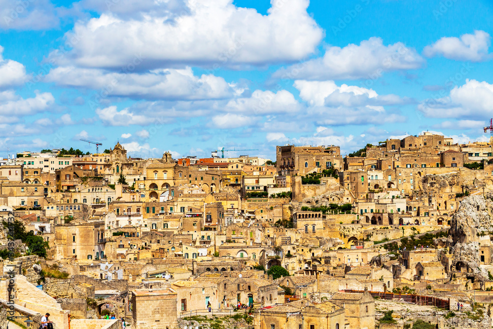 Old town elevated panoramic sunny summer view of Matera, Province of Matera, Basilicata Region, Italy