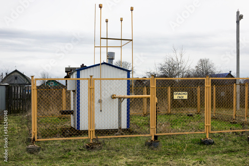 Fotografie Gas regulatory point on edge of village