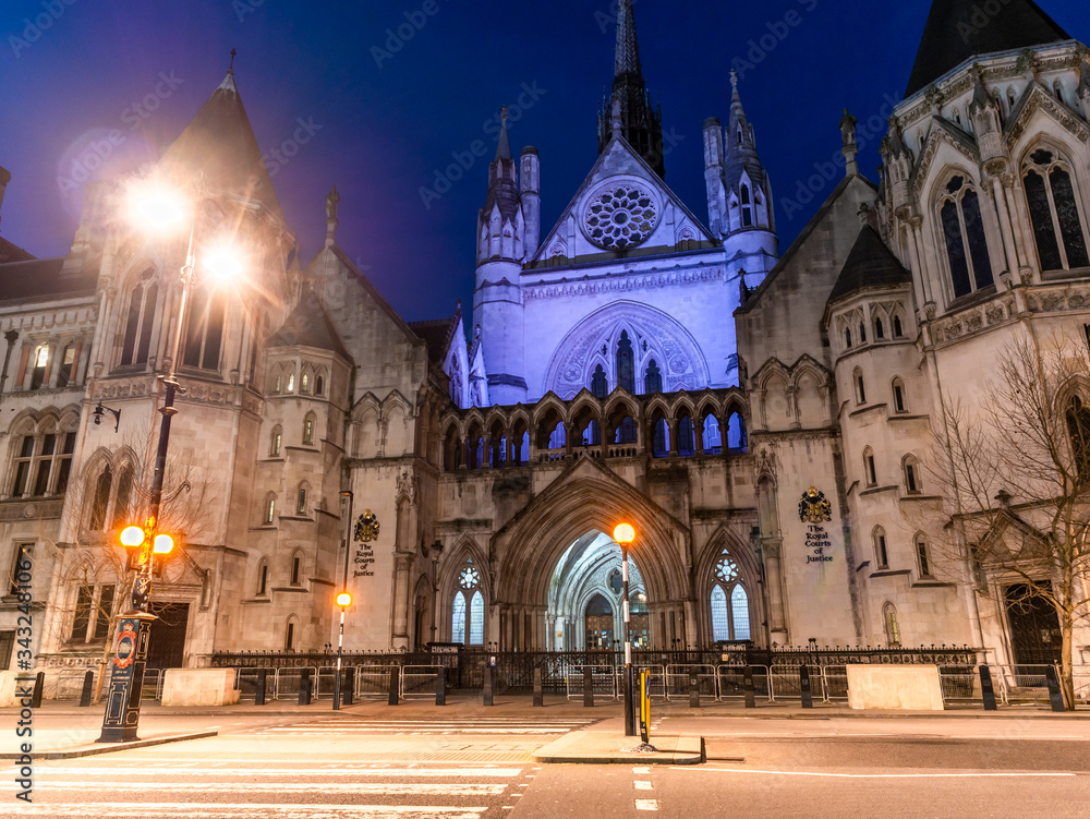 Night scene of the Victorian architecture of Royal Courts of Justice in London