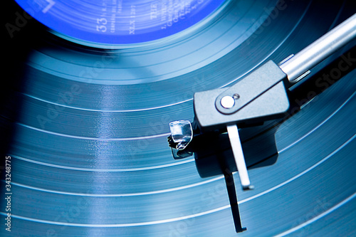 Vintage record player with spinning vinyl.