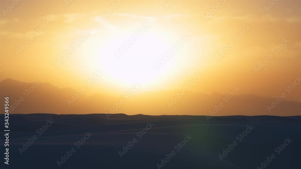 Timelapse time lapse of White sands dunes national monument and organ mountains with people walking dark sunset in New Mexico horizon and colorful yellow sky Timelapse time lapse of White sands dunes national monument and organ mountains with people walking dark sunset in New Mexico horizon and colorful yellow sky