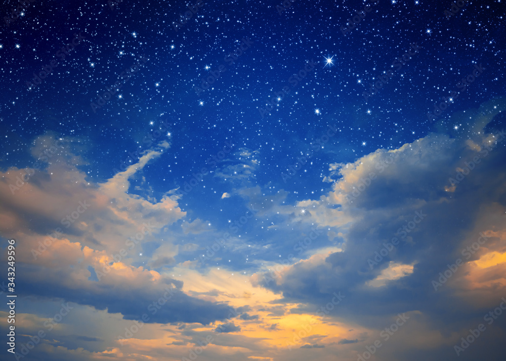 The starry sky and the blue sky together. Sunset. Night sky with stars and clouds. Sunrise in morning sky with star and milky way. Day turns to night. Magic background with stars and clouds.