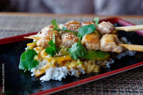 Teriyaki chicken with rice on restaurant table