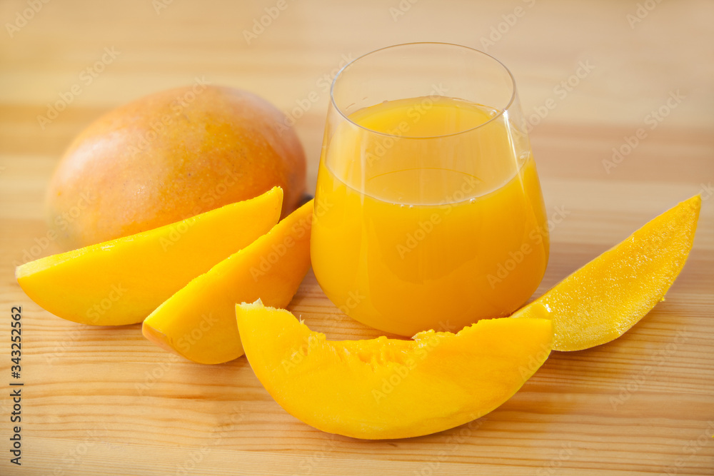 Delicious fresh squeezed mango juice in  transparent glass