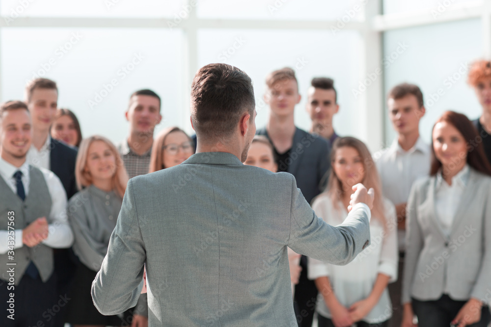 businessman speaking with addressing his business team. businessman speaking with addressing his business team.