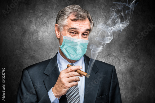 Fotografi Masked businessman smoking a cigar