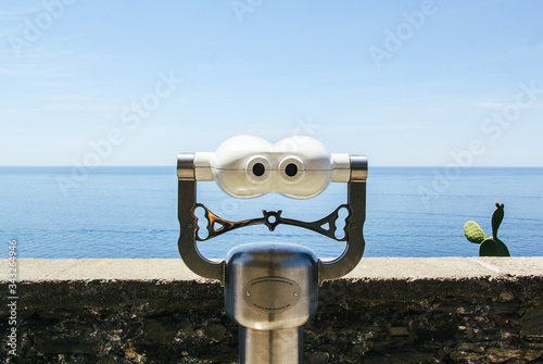 Coin operated binoculars with views of the sea photo