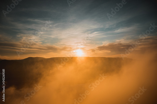 Orange sunset view at mountains in Azerbaijan. Cloudy weather. © zef art