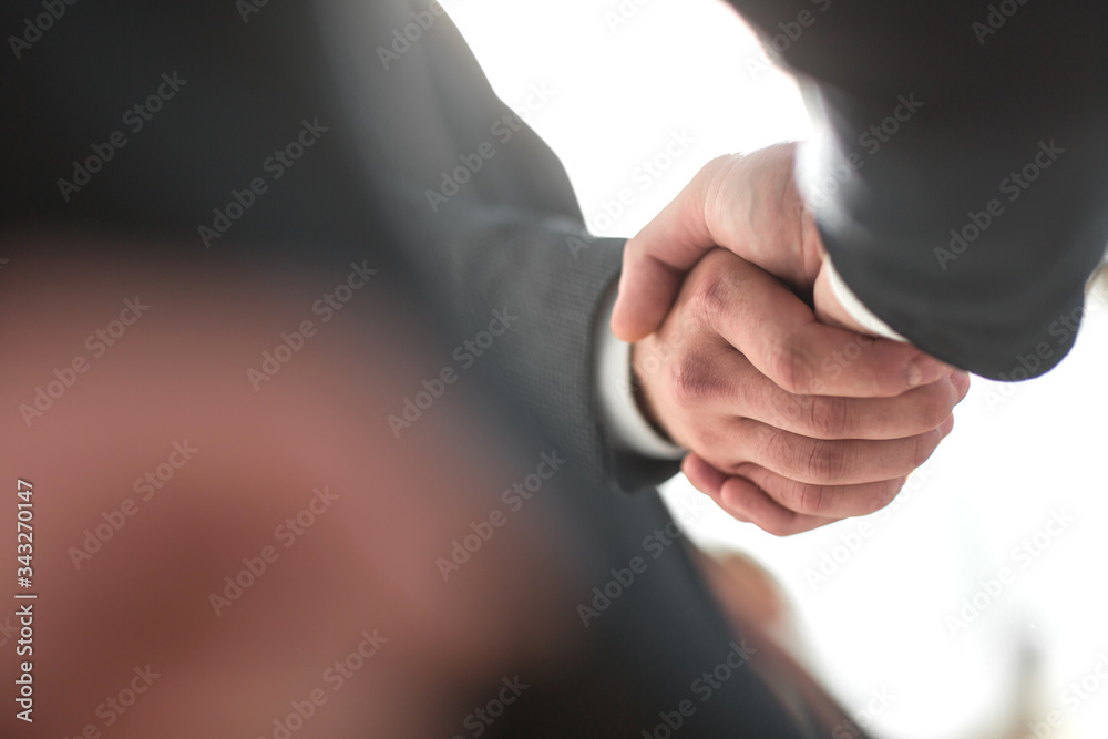 close up. strong handshake of business people . close up. strong handshake of business people .