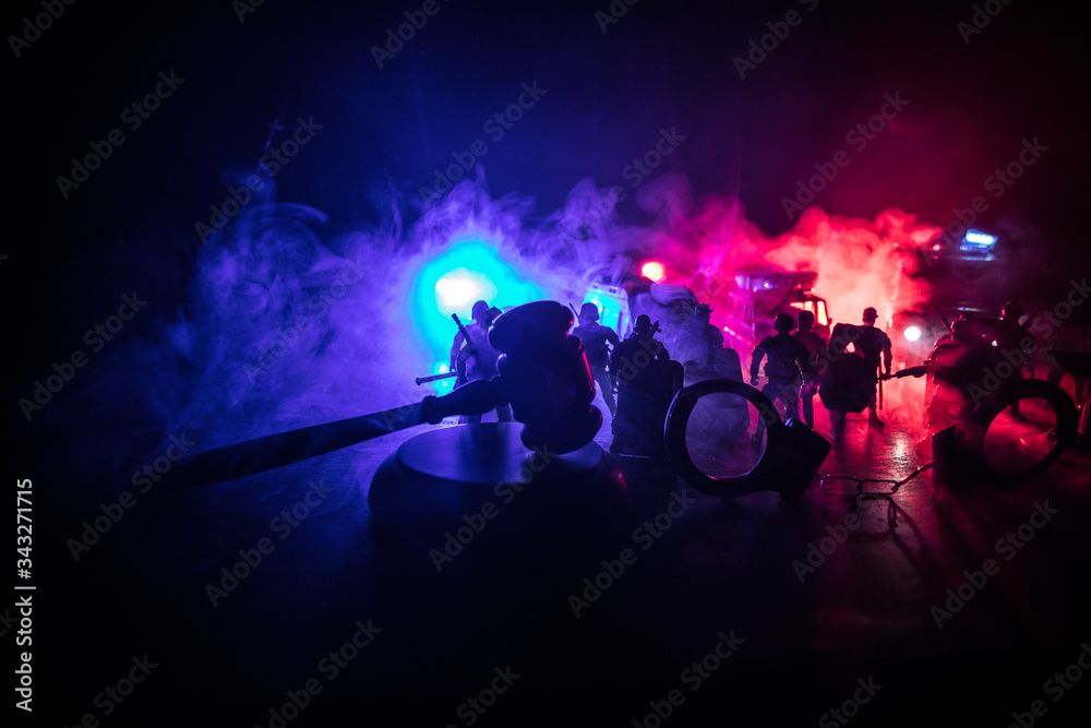 Police cars at night. Police car chasing a car at night with fog background. 911 Emergency response police car speeding to scene of crime. Selective focus Police cars at night. Police car chasing a car at night with fog background. 911 Emergency response police car speeding to scene of crime. Selective focus