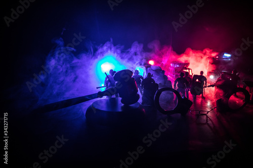 Police cars at night. Police car chasing a car at night with fog background. 911 Emergency response police car speeding to scene of crime. Selective focus