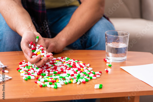Young man suffering at home