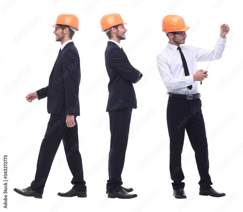 in full growth .a qualified architect in an orange helmet in full growth .a qualified architect in an orange helmet