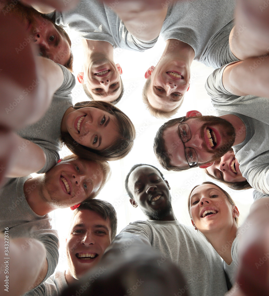 Fototapeta premium bottom view. group of successful young people looking at the cam