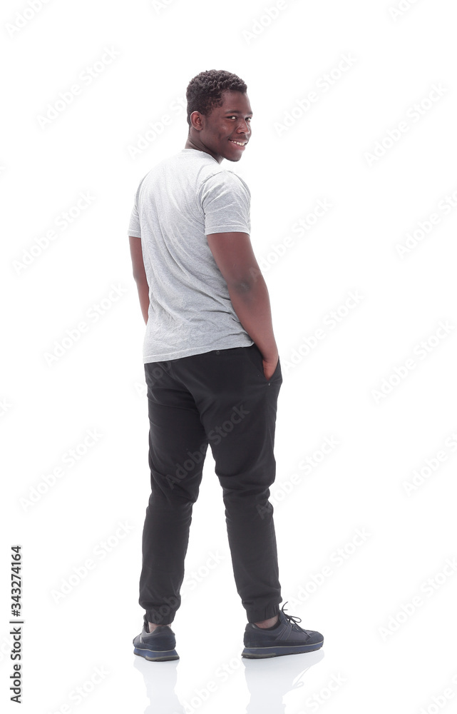 rear view. young man looking at white blank screen.