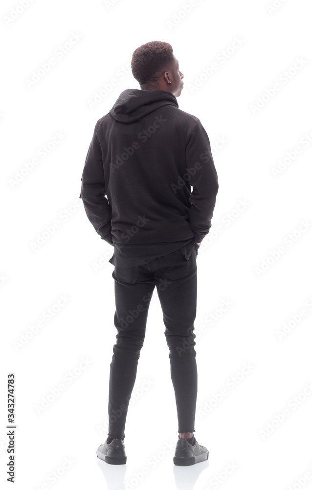 serious guy looking at the white wall. isolated on white serious guy looking at the white wall. isolated on white