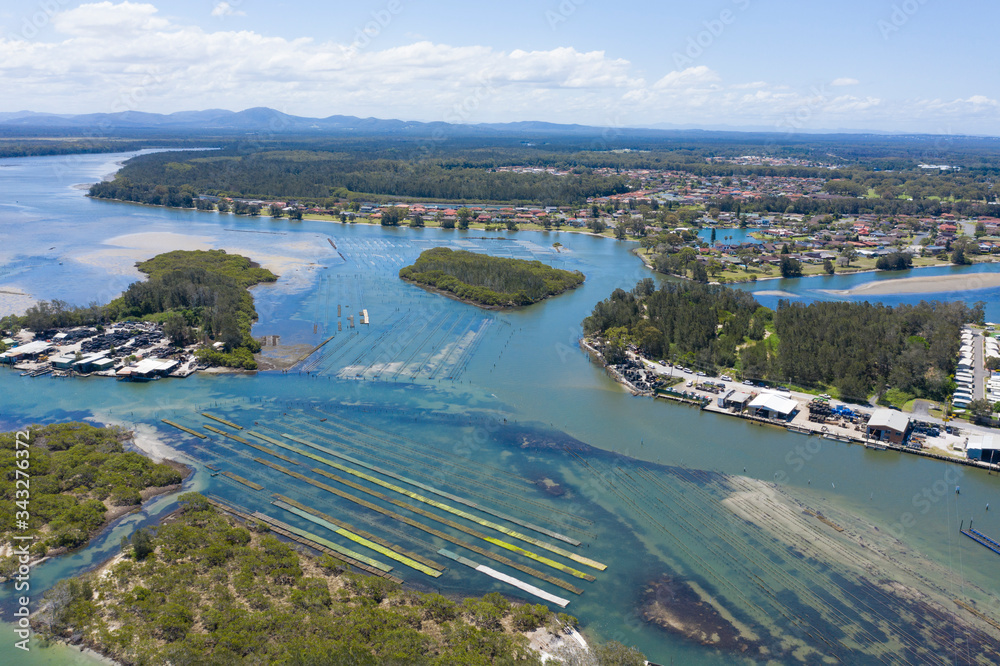 Wallis lakes on the north coast of New South Wales, Australia show oyster lease farms growing oysters.
