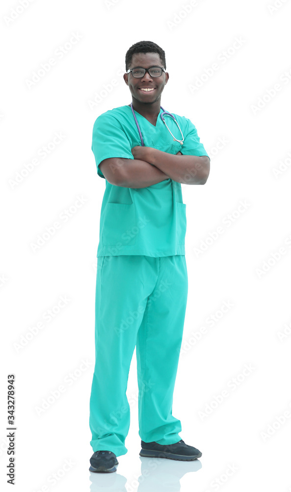 in full growth. smiling doctor in blue uniform. in full growth. smiling doctor in blue uniform.