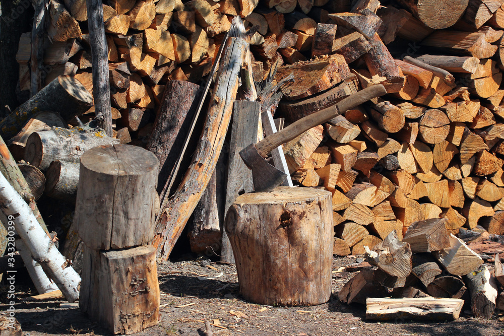 Fotografie Old axe and stack of firewood
