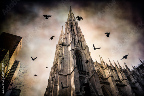 Pigeons flying over St. Patricks Cathedral in New York City with vintage grunge texture effect. photo