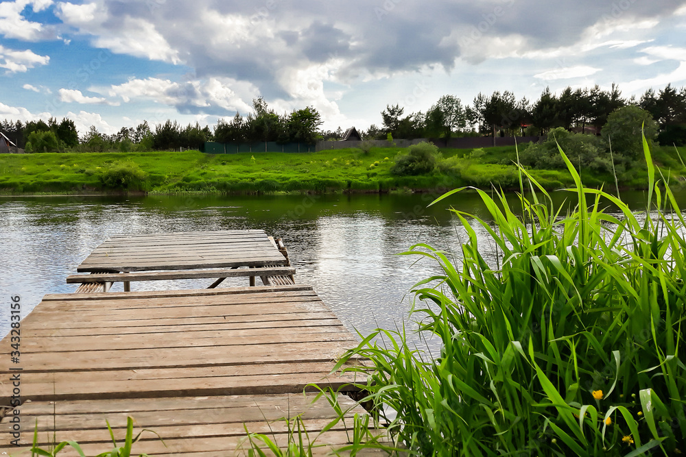 Wooden pier on the river. Countryside view Wooden pier on the river. Countryside view