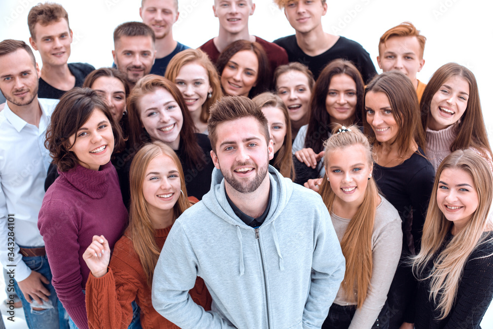 close up. confident guy standing among his friends