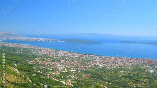 View at small mediterranean coastal town Kastela Stafilic in suburb of town Split, Croatia Europe. Mediterranean town Kastela Croatia. Beautiful coastal towns in Croatia. Airport of Split. photo