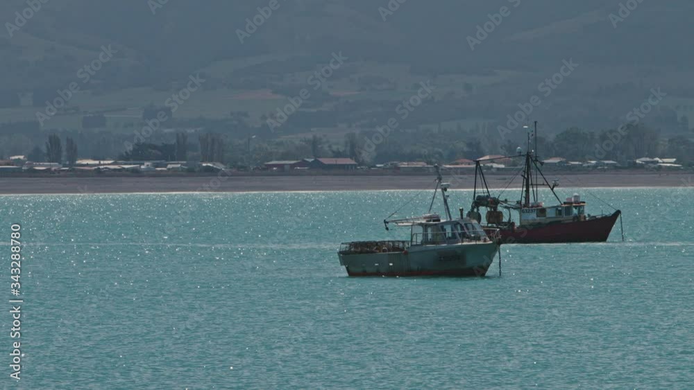 Group of Crayfish boats anchored just of shore of kiakoura, New Zealand . Group of Crayfish boats anchored just of shore of kiakoura, New Zealand .