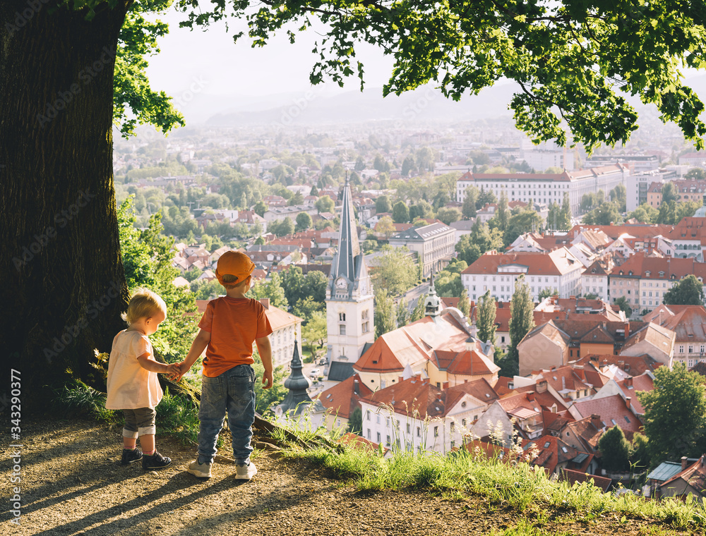 Φωτογραφία Little children on background of Ljubljana, Slovenia, Europe.