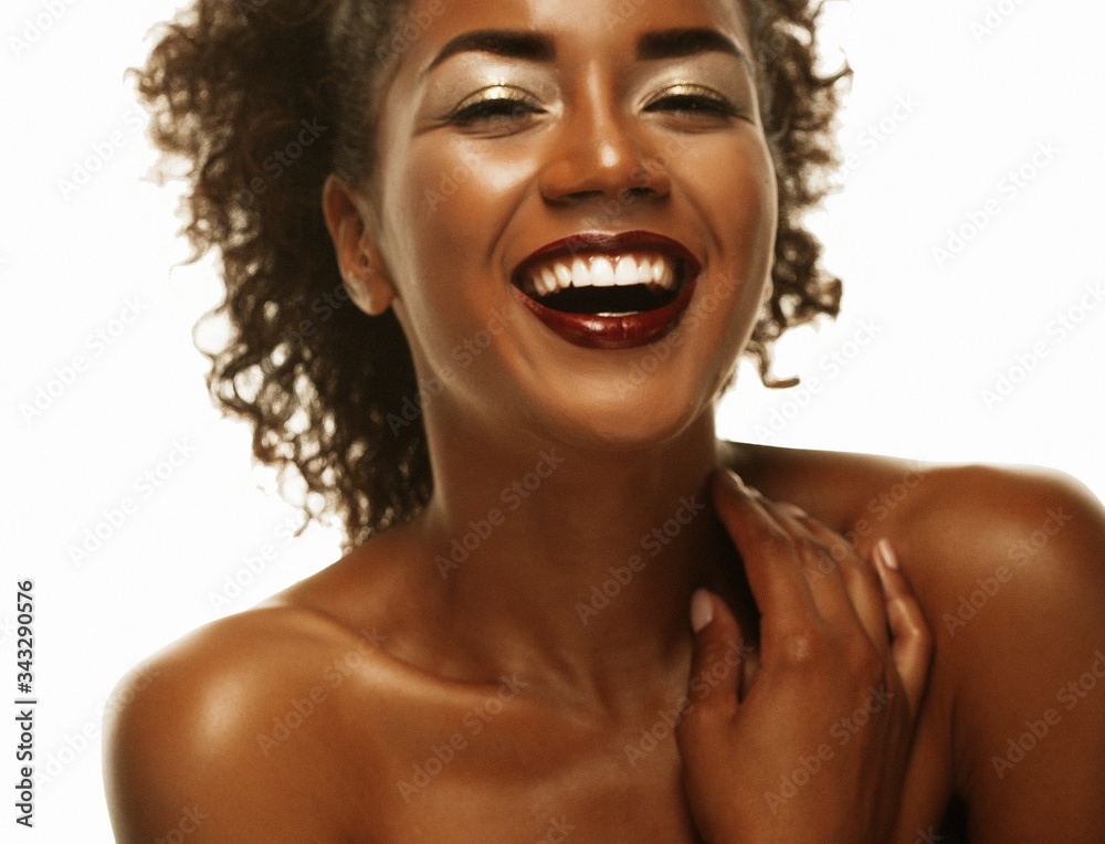 lifestyle and people concept: Portrait of a beautiful young African woman smiling. lifestyle and people concept: Portrait of a beautiful young African woman smiling.