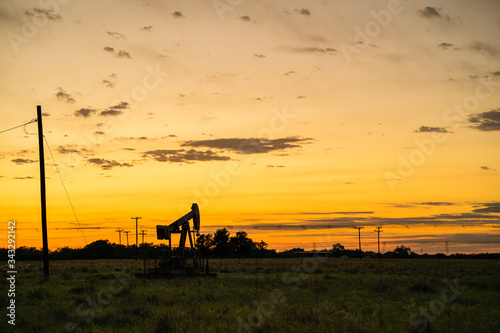 A landscape view of an oil drill in central Texas