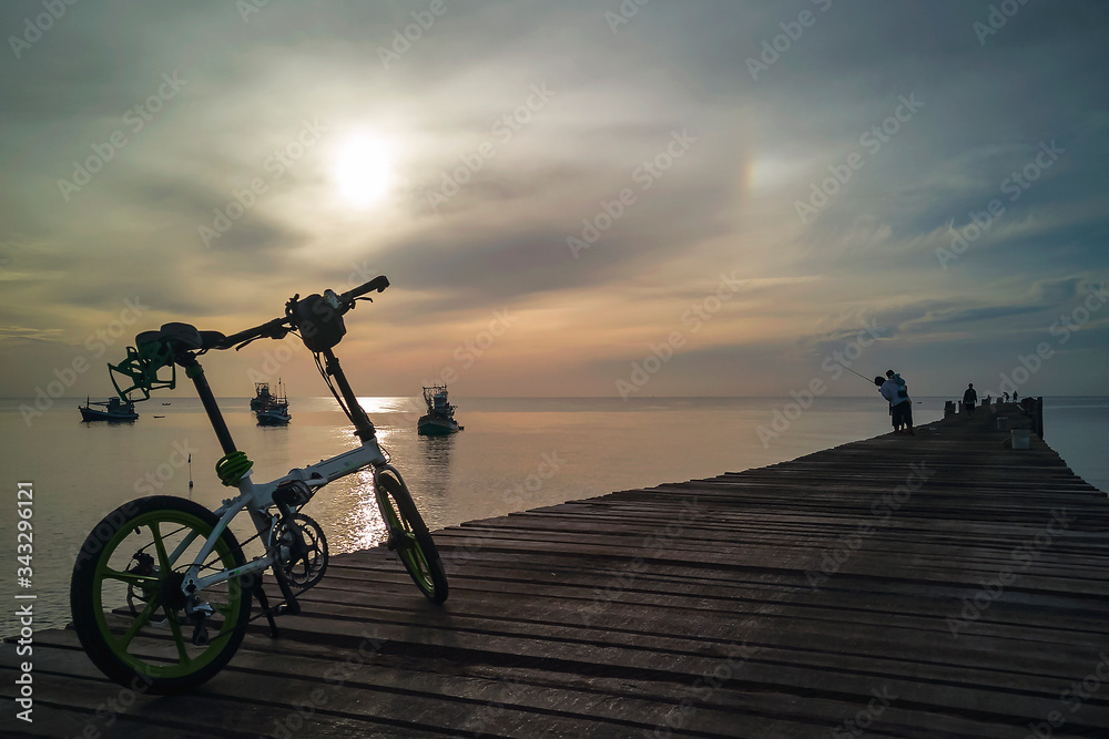Fototapeta premium Morning view of the wooden bridge on the coast at Thap Sakae, Prachuap Khiri Khan, Thailand.