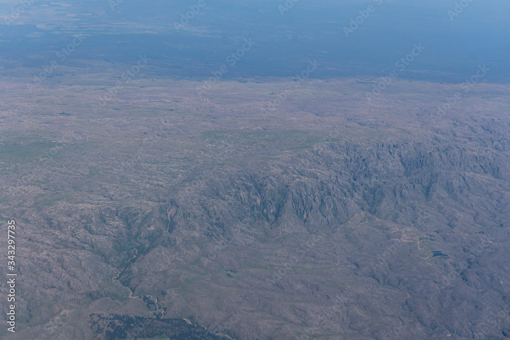 An aerial view from airplane of 'Los Gigantes' a mountain area near Tanti, Córdoba, Argentina