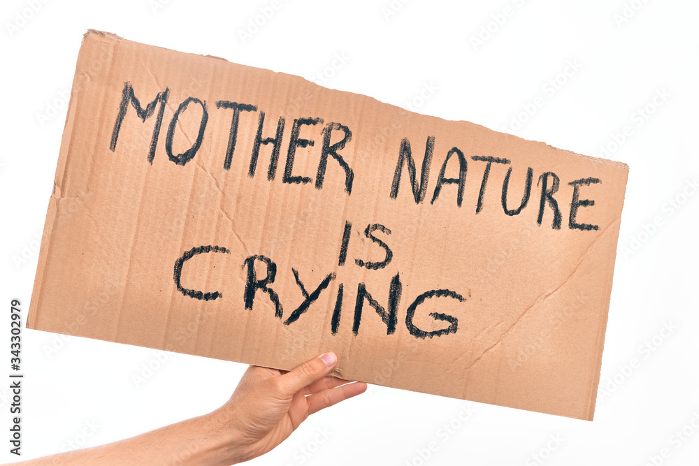 Cardboard banner with MOTHER NATURE IS CRYING text, protesting against climate change over isolated white background Cardboard banner with MOTHER NATURE IS CRYING text, protesting against climate change over isolated white background