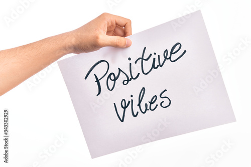 Cardboard banner with POSITIVE VIBES text over isolated white background