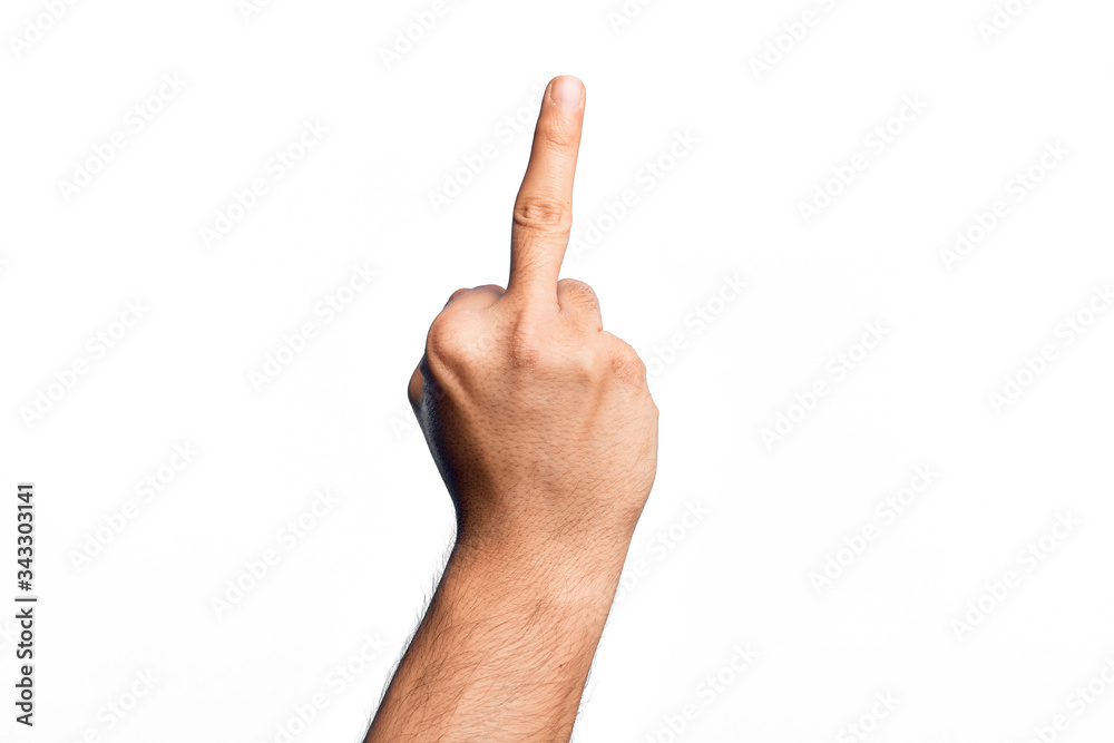 Hand of caucasian young man showing fingers over isolated white background showing provocative and rude gesture doing fuck you symbol with middle finger Hand of caucasian young man showing fingers over isolated white background showing provocative and rude gesture doing fuck you symbol with middle finger