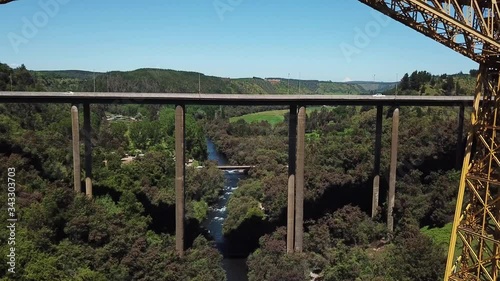 Malleco Viaduct and Panamericana Highway. Cinematic Aerial of Old Railway and Modern Bridge Above River Canyon, Chile photo