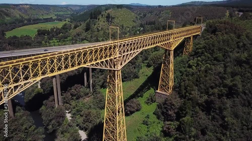 Malleco Viaducto and Panamericana Highway. Drone Aerial View of Steel Railway Bridge and Modern Motorway in Countryside of Chile photo
