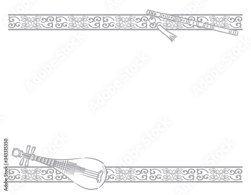 Frame with chinese instruments and decorative border. photo