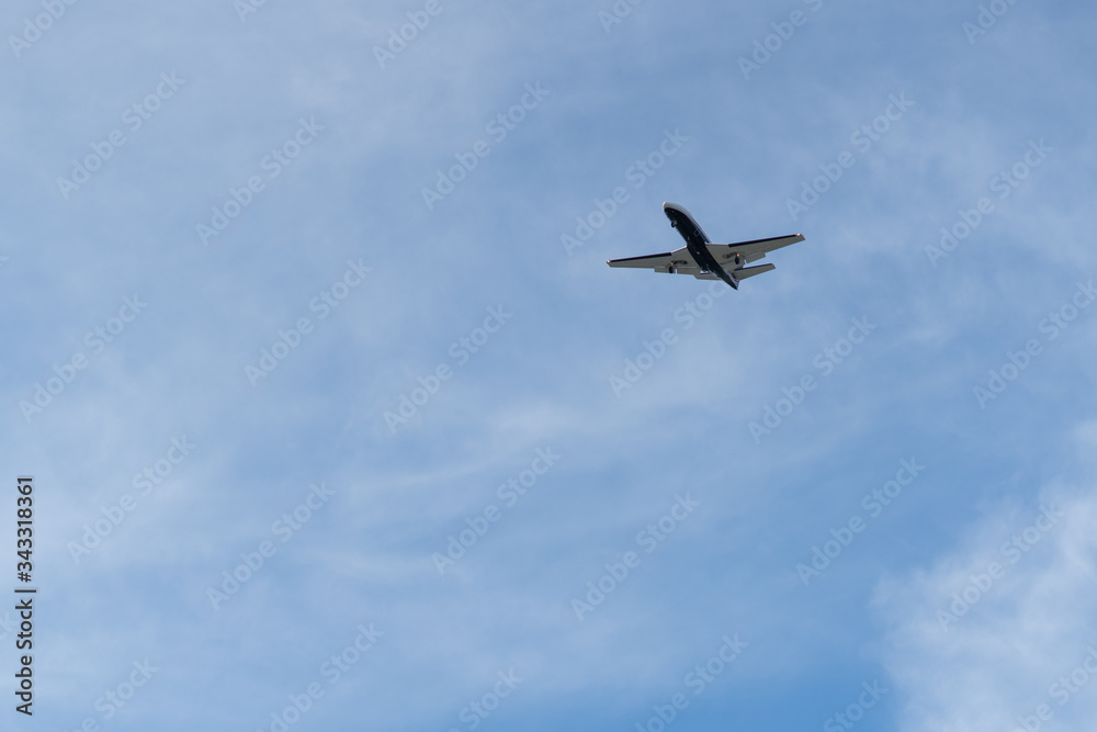 Airplane on a cloudy sky background on a sunny day. Airplane on a cloudy sky background on a sunny day.