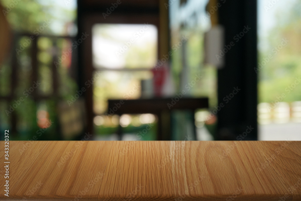 Empty dark wooden table in front of abstract blurred bokeh background of restaurant . can be used for display or montage your products.Mock up for space. Empty dark wooden table in front of abstract blurred bokeh background of restaurant . can be used for display or montage your products.Mock up for space.